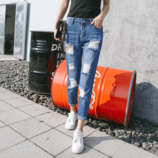 High-waisted ripped jeans woman